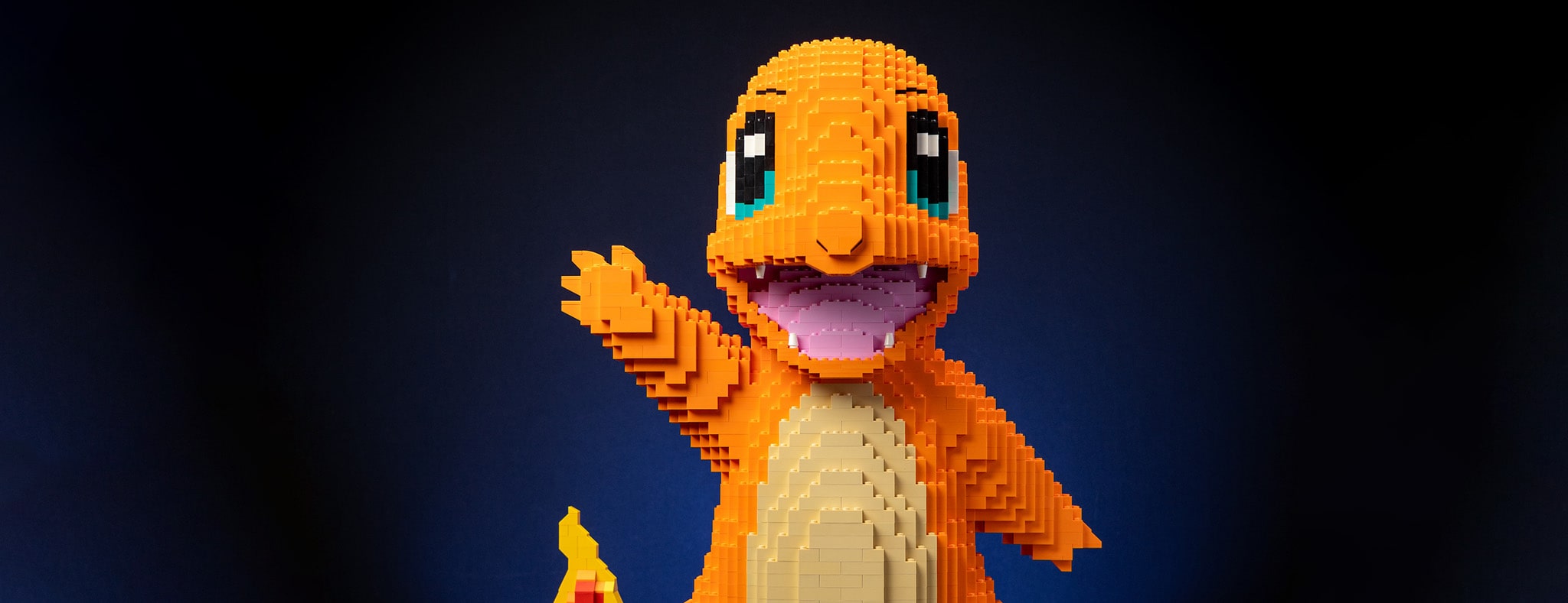 Fire Lizard Life-Sized Sculpture in LEGO Bricks Waving Hello