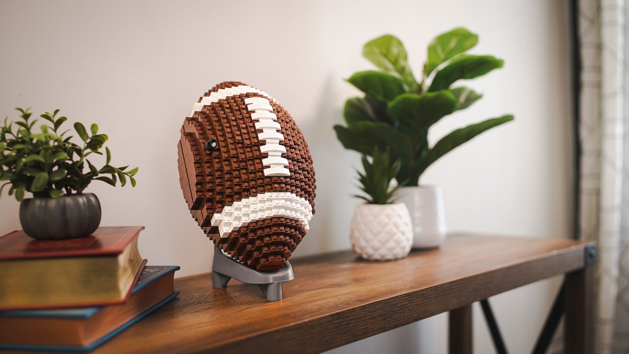 American Football Life Sized Built with LEGO Bricks by Bricker Builds on Display Stand