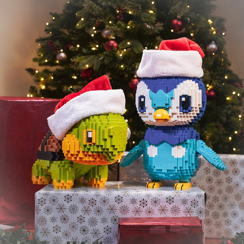 Proud Penguin and World Turtle Christmas Presents wearing Santa Hats Life-Sized Sculptures built with LEGO® bricks - by Bricker Builds