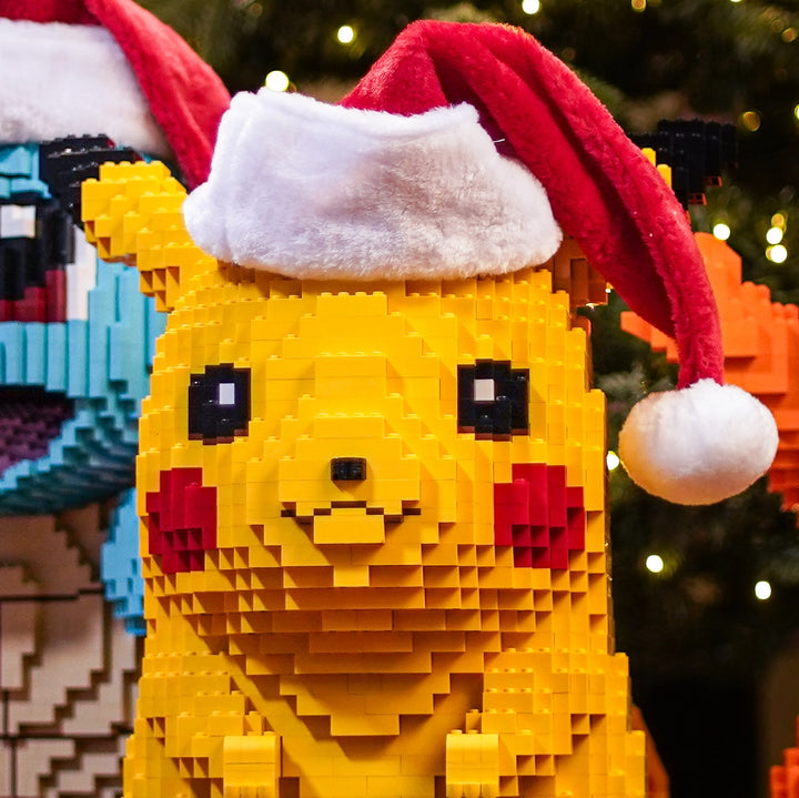 Electric Mouse wearing Santa Hat by the Christmas Tree in LEGO Bricks Life-Sized Replica by Bricker Builds