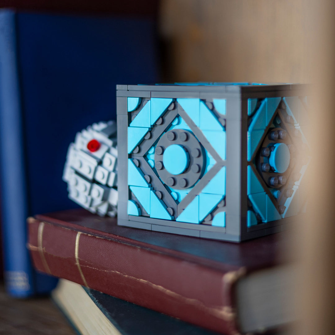 Holocube by Bricker Builds made of LEGO Bricks next to EMP Grenade on a shelf