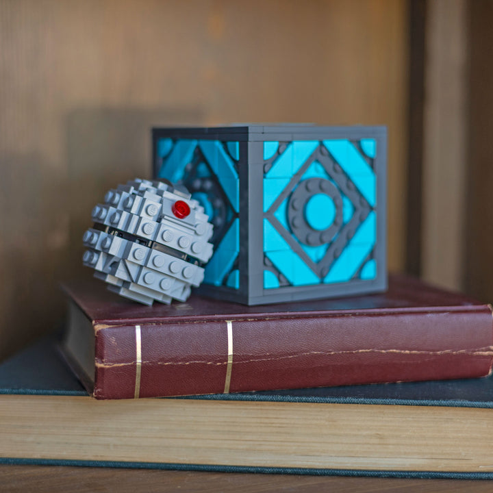 Holocube by Bricker Builds made of LEGO Bricks next to EMP Grenade on a shelf2