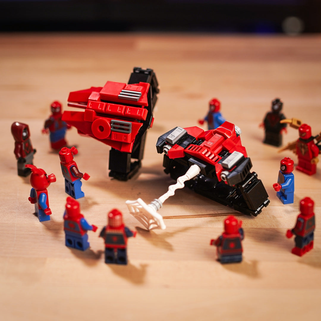 Web shooters sourounded by spider-man minifigs