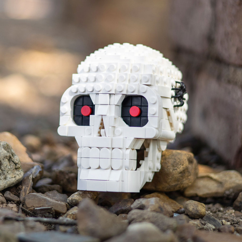 Skull made of LEGO® bricks by Bricker Builds on rocks